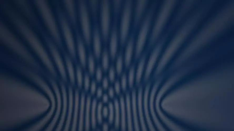 Abstract wave interference pattern in warm gold