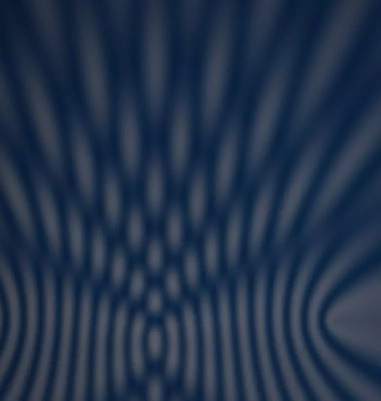 Abstract wave interference pattern in warm gold
